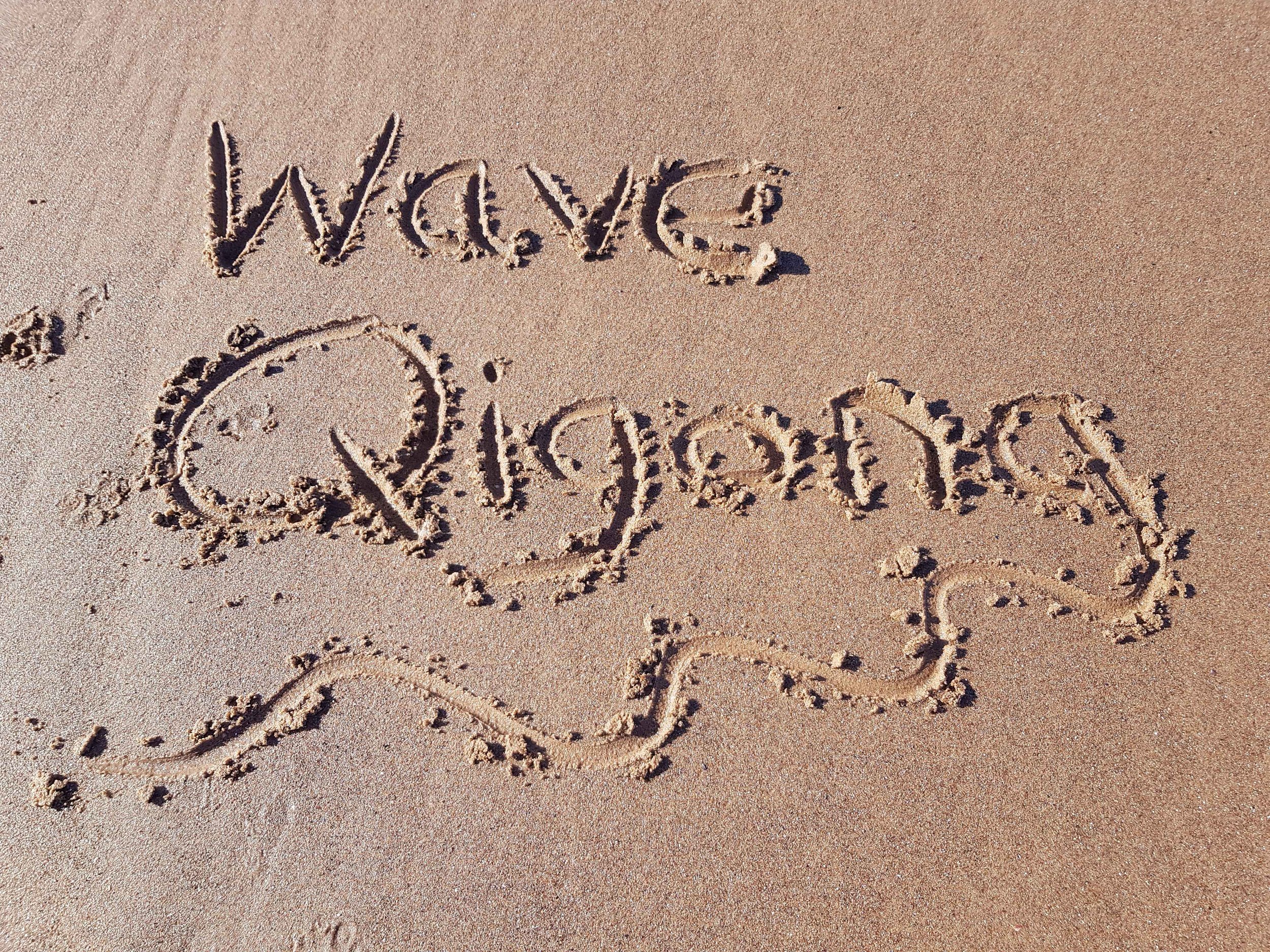 Wave Qigong written in the sand